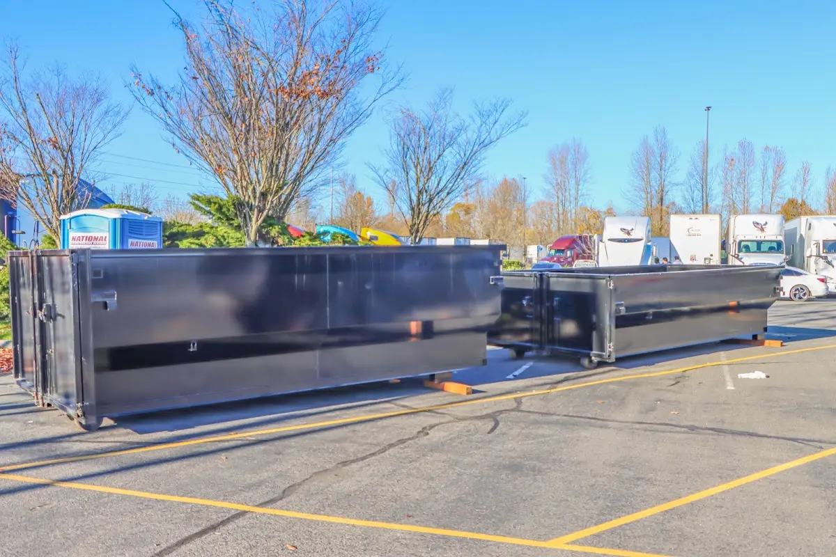 Professional dumpster rental service with roll-off container on residential driveway in Bethel Park